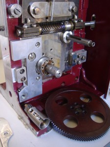 Early type Western Electric gear mounting plate and drive gear ready to fix onto the plate of an early C&W model D Note the early oiling hole