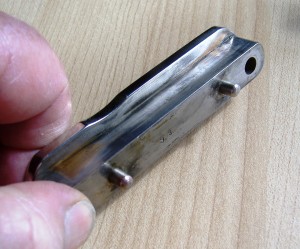 Spindle shaft slider securing bracket is also cleaned with steel wool