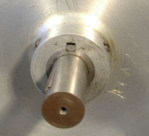 The alignment is gauged by edge of the Driven Shaft bearing