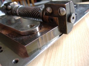 Unusual wear is noticed on the sloping end of the spindle slider